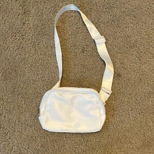 Compact White Crossbody Bag with Adjustable Strap